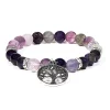 Photo d'un bracelet perle d'améthyste et de fluorite avec un pendentif arbre de vie accrocher